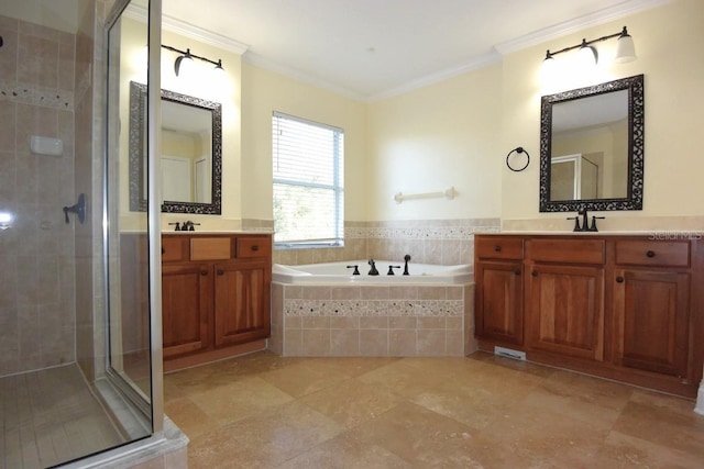 bathroom featuring ornamental molding, separate shower and tub, and vanity