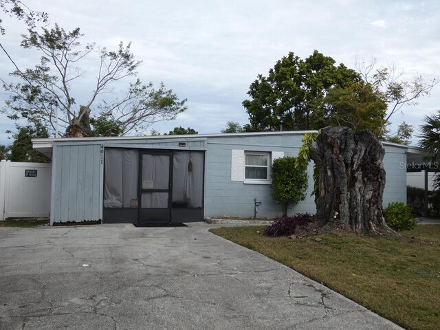 view of outdoor structure featuring a lawn