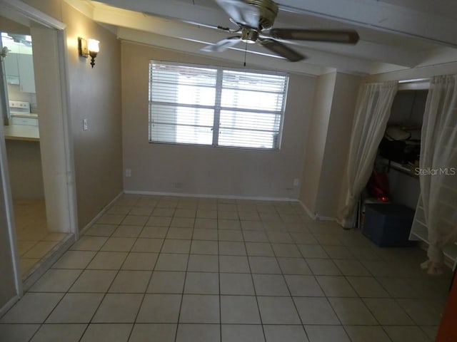 unfurnished room with ceiling fan and light tile patterned floors