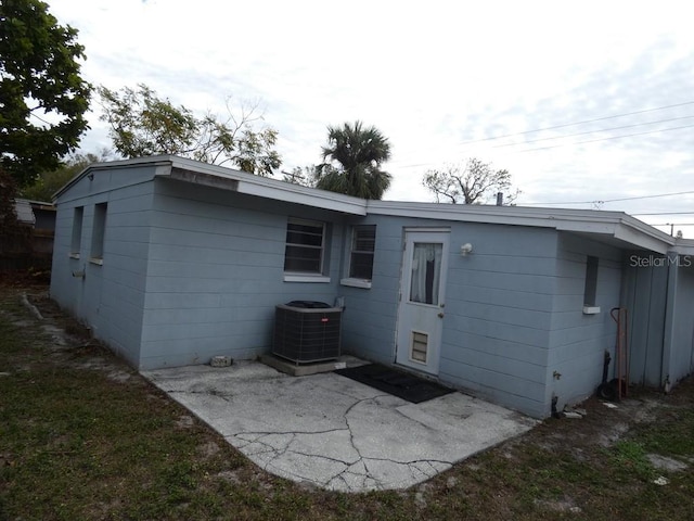 back of house with a patio and cooling unit