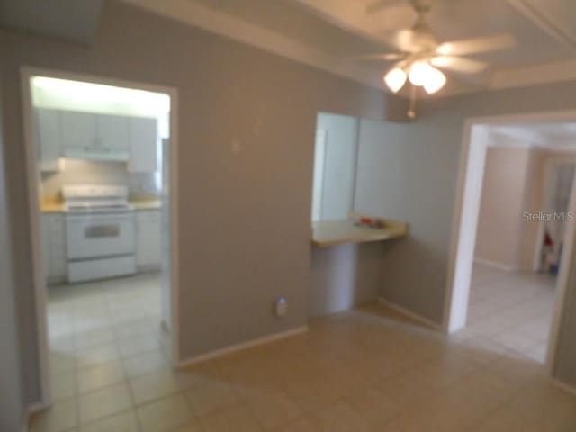 interior space featuring light tile patterned flooring and ceiling fan