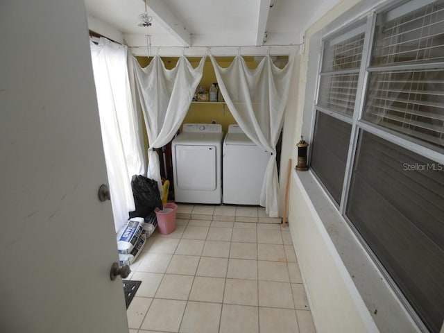 washroom with light tile patterned flooring and separate washer and dryer