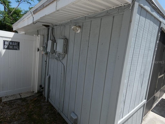 view of home's exterior with a gate