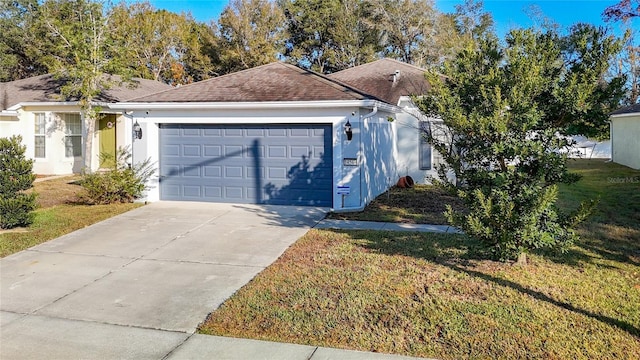 exterior space with a garage and a front lawn