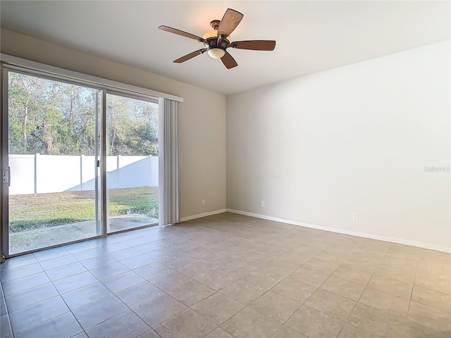 empty room with light tile patterned flooring and ceiling fan