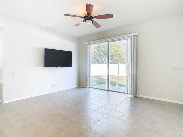 unfurnished living room featuring ceiling fan and light tile patterned floors