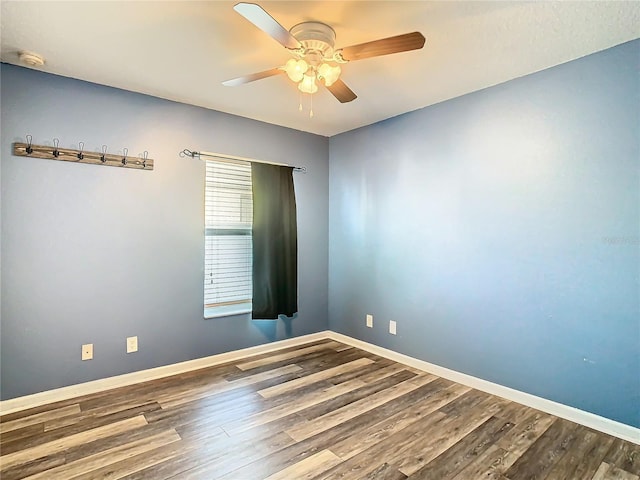 unfurnished room featuring hardwood / wood-style floors and ceiling fan