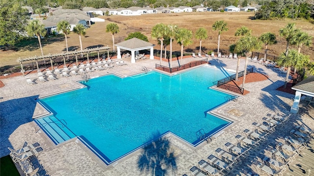 view of swimming pool featuring a gazebo and a patio