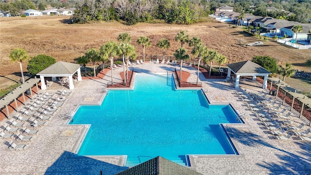 view of swimming pool featuring a patio and a gazebo