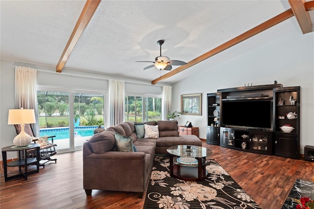 living room featuring ceiling fan, a textured ceiling, dark hardwood / wood-style flooring, and lofted ceiling with beams