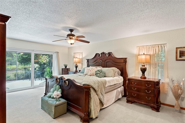 bedroom with ceiling fan, access to outside, and light carpet