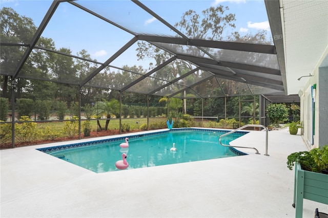 view of swimming pool with a lanai and a patio