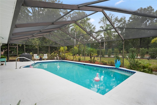 view of pool featuring a lanai and a patio