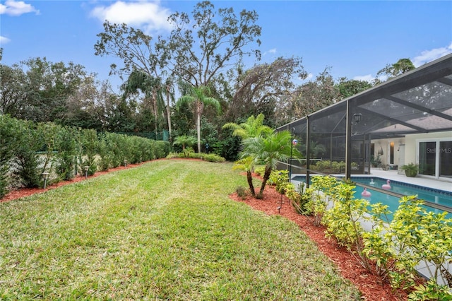 view of yard with glass enclosure