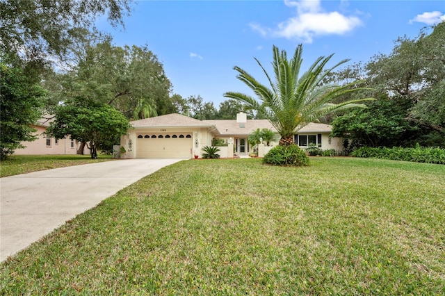 ranch-style home featuring a front lawn and a garage