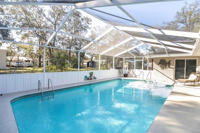 view of pool with a lanai, a fenced in pool, and a patio