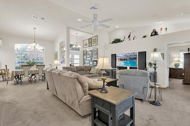 living room featuring lofted ceiling, light colored carpet, and visible vents