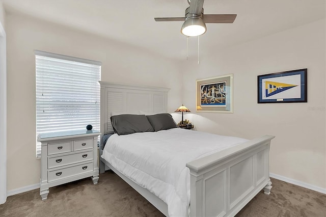 bedroom with baseboards, carpet, and a ceiling fan