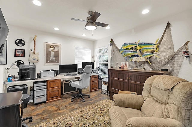 office space featuring stone finish floor, recessed lighting, and a ceiling fan