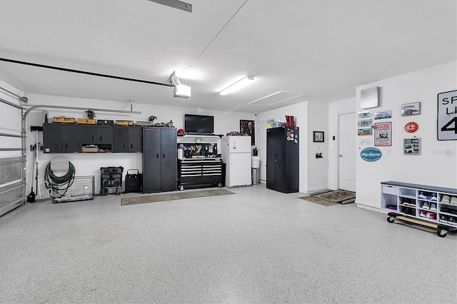 garage with freestanding refrigerator