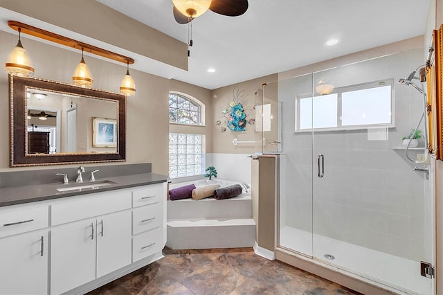 bathroom with vanity, recessed lighting, a stall shower, ceiling fan, and a bath