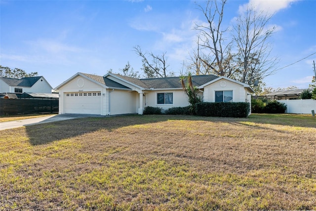 ranch-style home with a front lawn and a garage