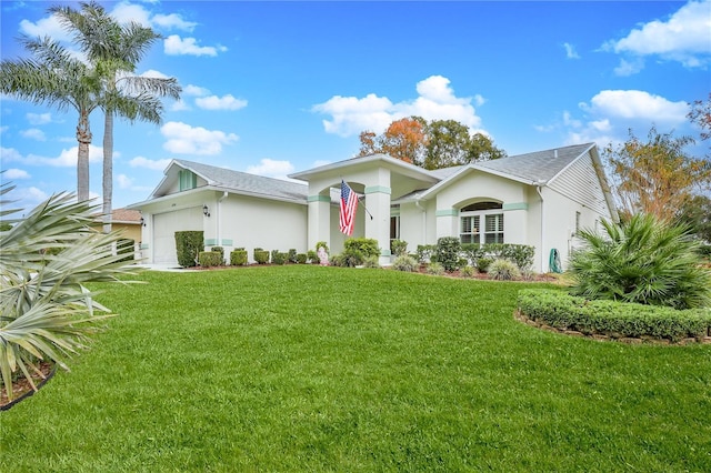 view of front facade featuring a front yard and a garage