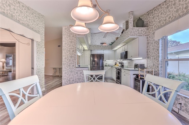 dining room with hardwood / wood-style floors