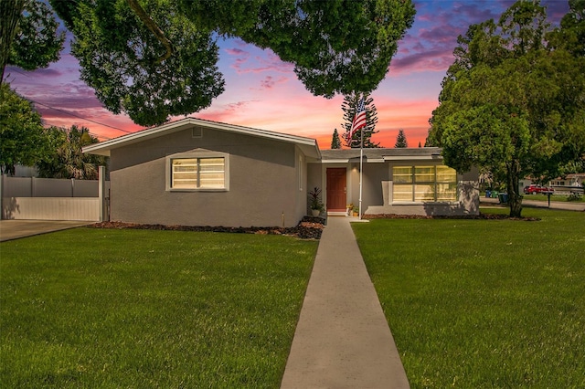 ranch-style house with a yard