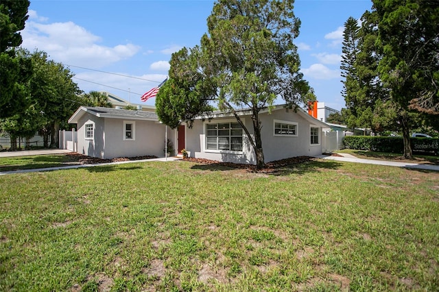 ranch-style house featuring a front lawn