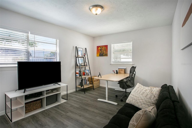 home office with dark hardwood / wood-style flooring