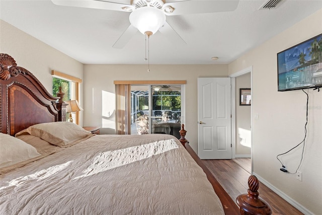 bedroom with access to outside, ceiling fan, and dark hardwood / wood-style flooring