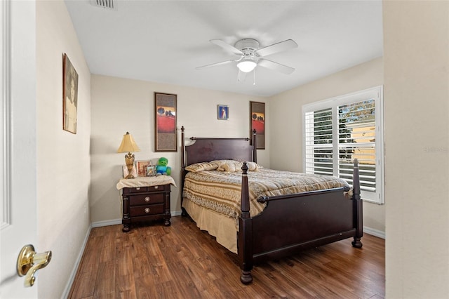 bedroom with ceiling fan and dark wood-type flooring