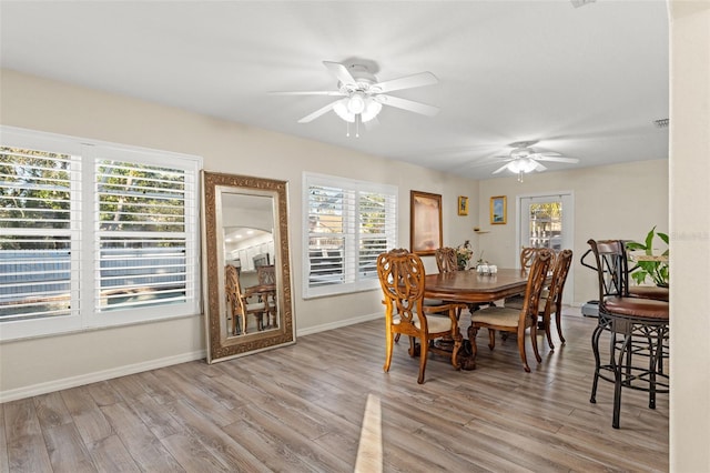 dining area featuring ceiling fan and light hardwood / wood-style flooring