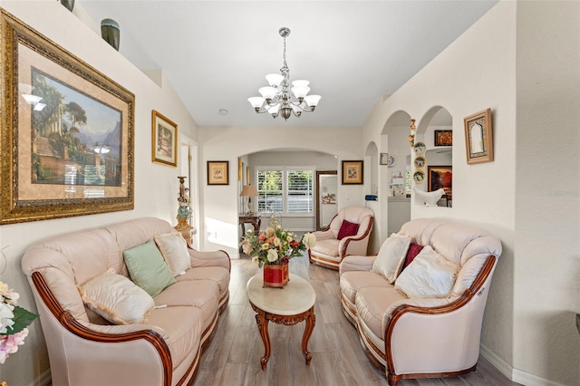 living room featuring a chandelier and hardwood / wood-style flooring