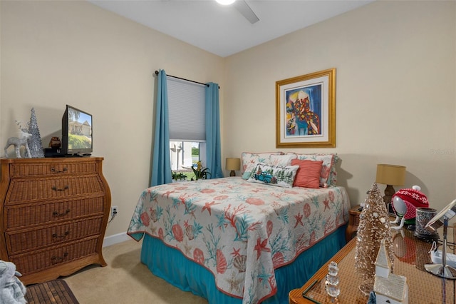 bedroom with ceiling fan and light colored carpet