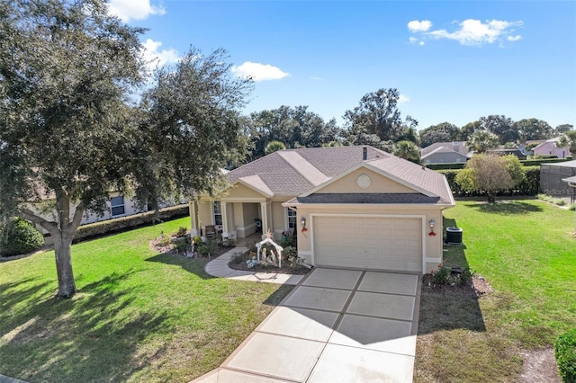 view of front of property featuring a garage and a front lawn