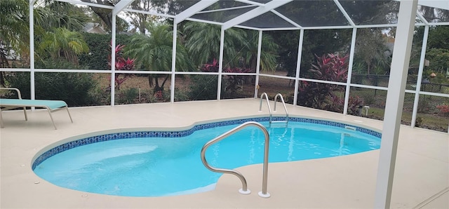 view of pool with a lanai and a patio