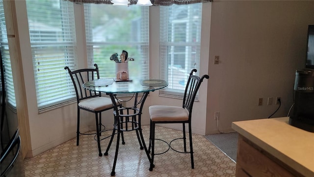 dining space with an inviting chandelier