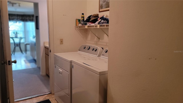 laundry room with washing machine and clothes dryer