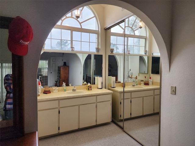 bathroom featuring vanity and an inviting chandelier