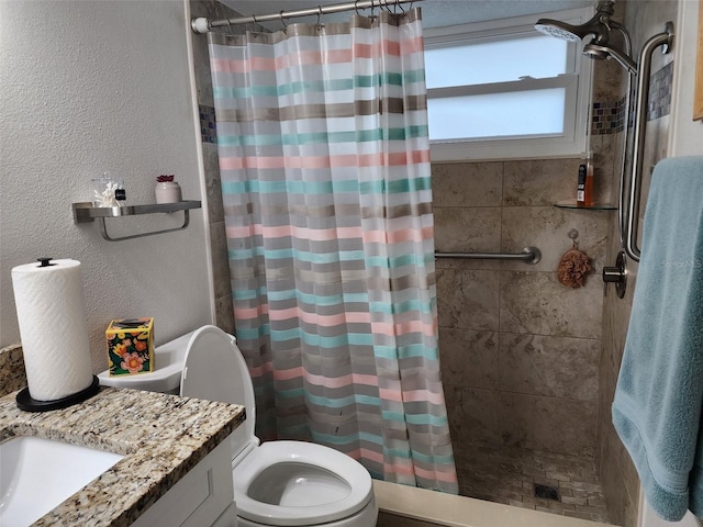 bathroom with toilet, a shower with shower curtain, and vanity