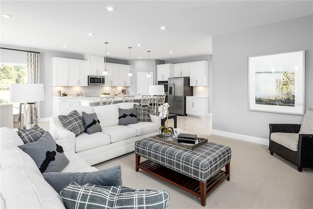 living room featuring light colored carpet