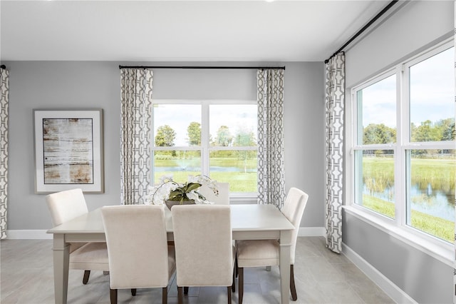 dining room with a water view