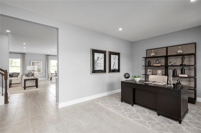 office space with light tile patterned floors