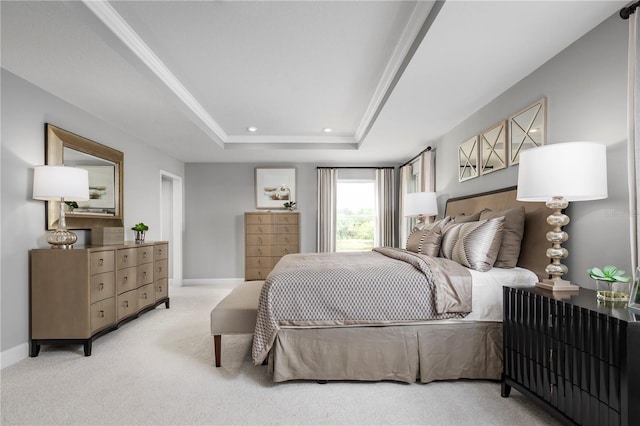 carpeted bedroom featuring crown molding and a raised ceiling