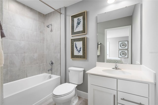 full bathroom with toilet, vanity, and tiled shower / bath