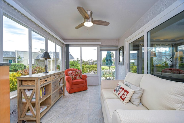 sunroom featuring ceiling fan