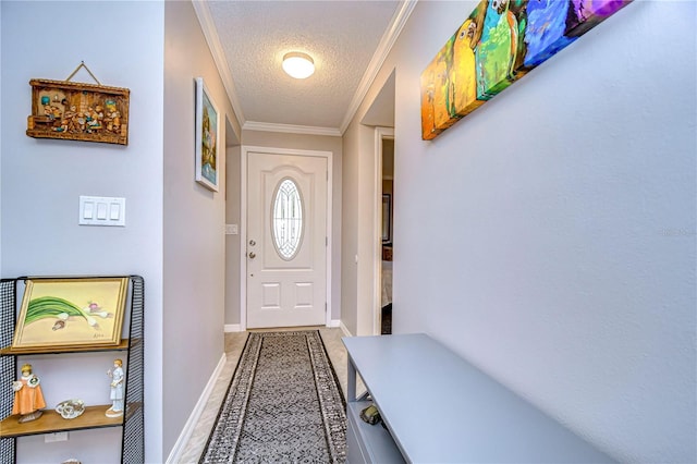 entryway with a textured ceiling and crown molding