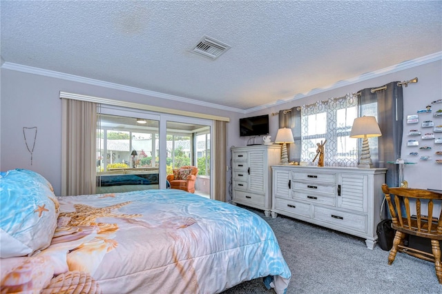 carpeted bedroom with a textured ceiling and ornamental molding